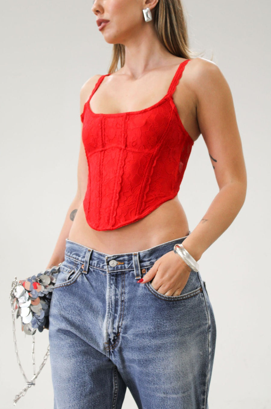 Knit lace bustier top. Adjustable straps. Boning in bodice. Back hook and eye closures. Fully lined. Going out top. Red tank top. Red bustier top. Red corset top.