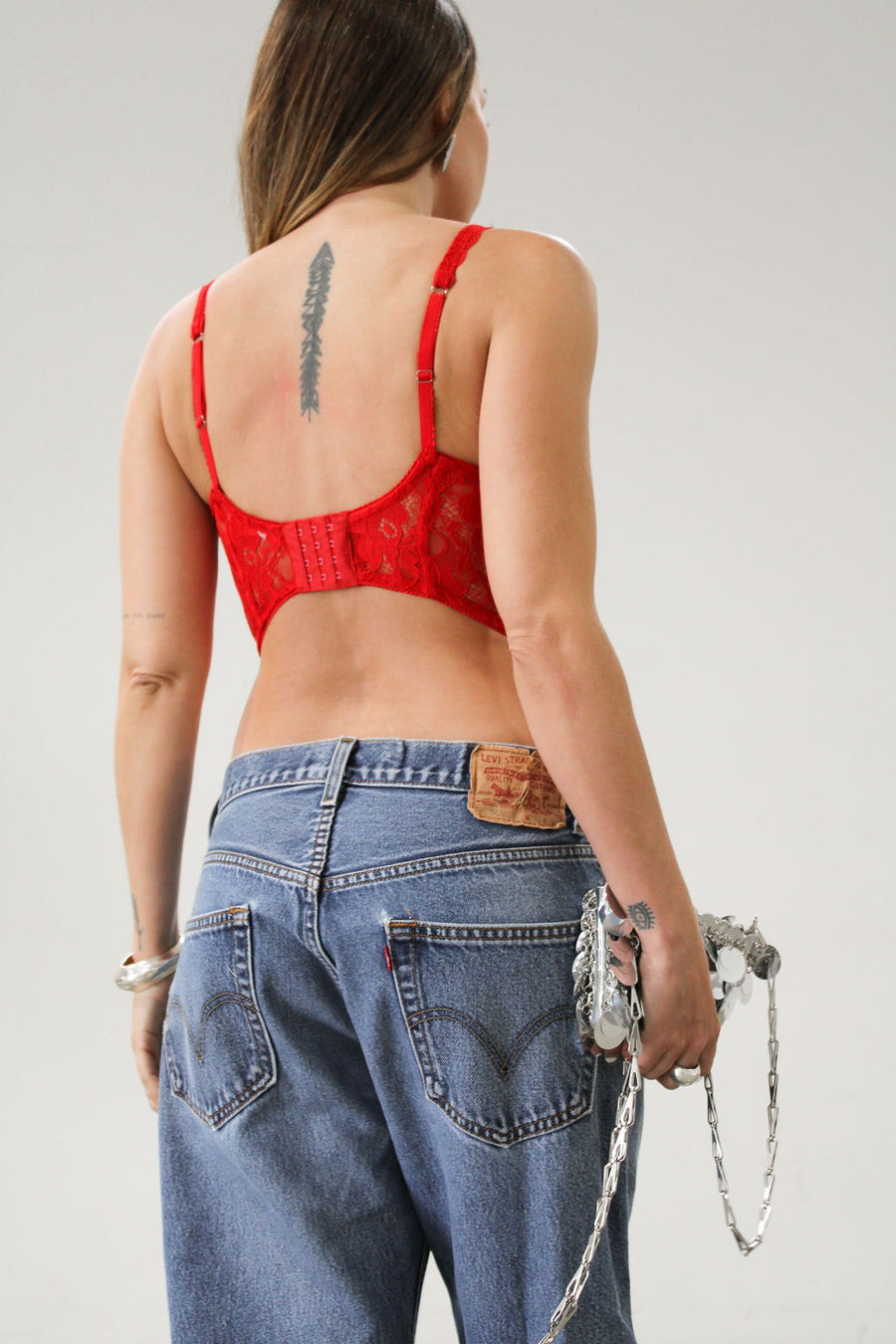 Knit lace bustier top. Adjustable straps. Boning in bodice. Back hook and eye closures. Fully lined. Going out top. Red tank top. Red bustier top. Red corset top.