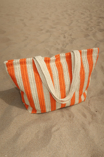 Striped straw tote bag. Fixed straps. Top zipper closure. Fully lined. Inner pocket. orange and tan beach bag. orange beach bag. orange straw beach bag. european summer bag. european summer accessories. european summer outfit inspo