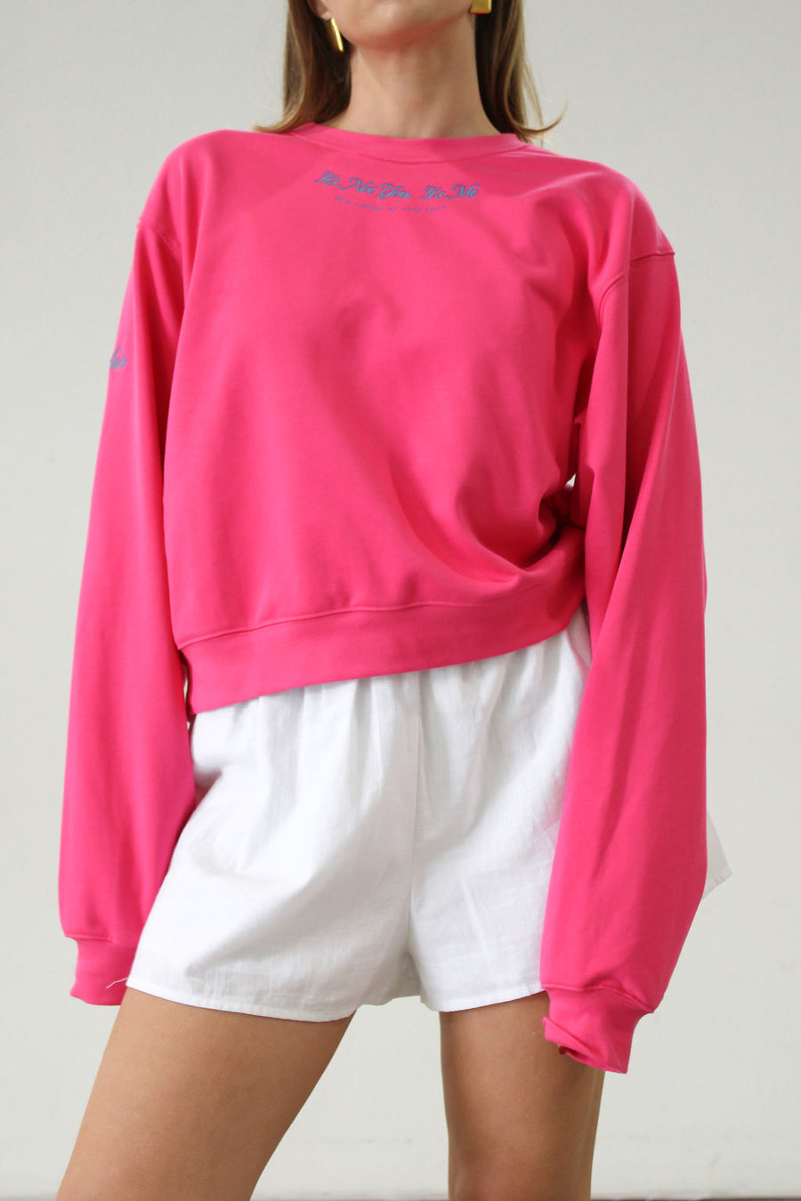 Graphic printed knit sweatshirt. Cropped fit. Unlined. Pink cropped oversized sweater. Airport outfit. Loungewear. Relaxing outfit.