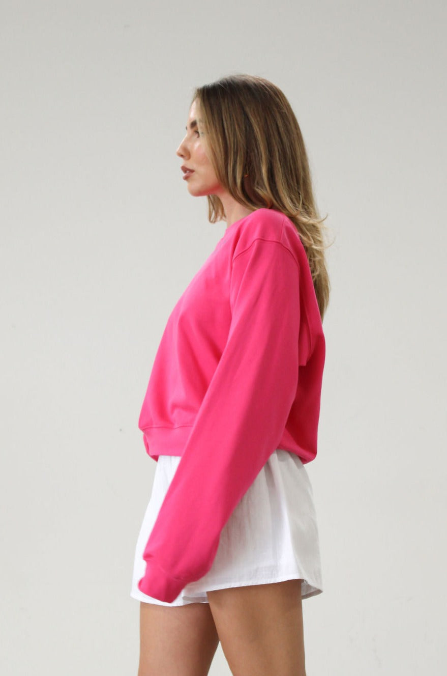 Graphic printed knit sweatshirt. Cropped fit. Unlined. Pink cropped oversized sweater. Airport outfit. Loungewear. Relaxing outfit.