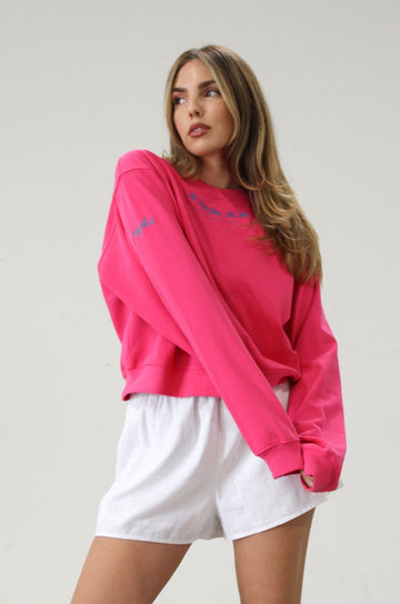 Graphic printed knit sweatshirt. Cropped fit. Unlined. Pink cropped oversized sweater. Airport outfit. Loungewear. Relaxing outfit.