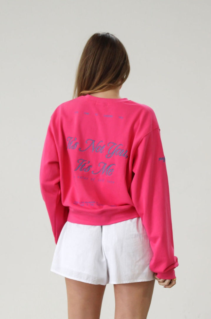 Graphic printed knit sweatshirt. Cropped fit. Unlined. Pink cropped oversized sweater. Airport outfit. Loungewear. Relaxing outfit.