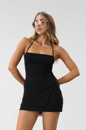 Knit top. Adjustable halter tie neck. Side slit. Unlined. Black top. Black halter tie top. Minimal top. Going out top. Side slit 