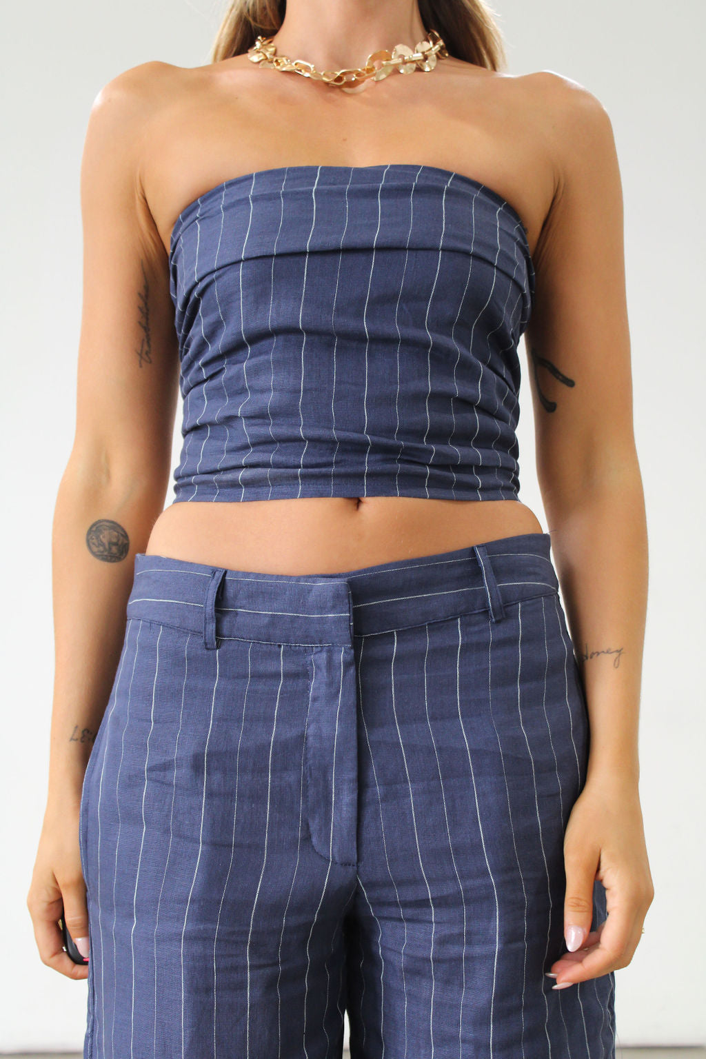 Striped woven top. Strapless side zipper closure. Elastic smocked back. Fully lined. Blue stripe tube top. Summer top. Tops to wear in summer. Tops to wear on vacation