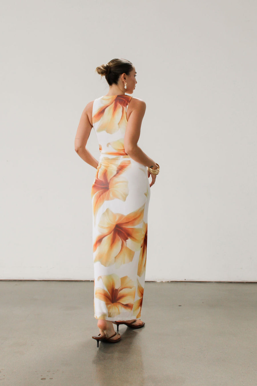 Floral knit mesh maxi dress. Sleeveless. Ruched sides. Fully lined.