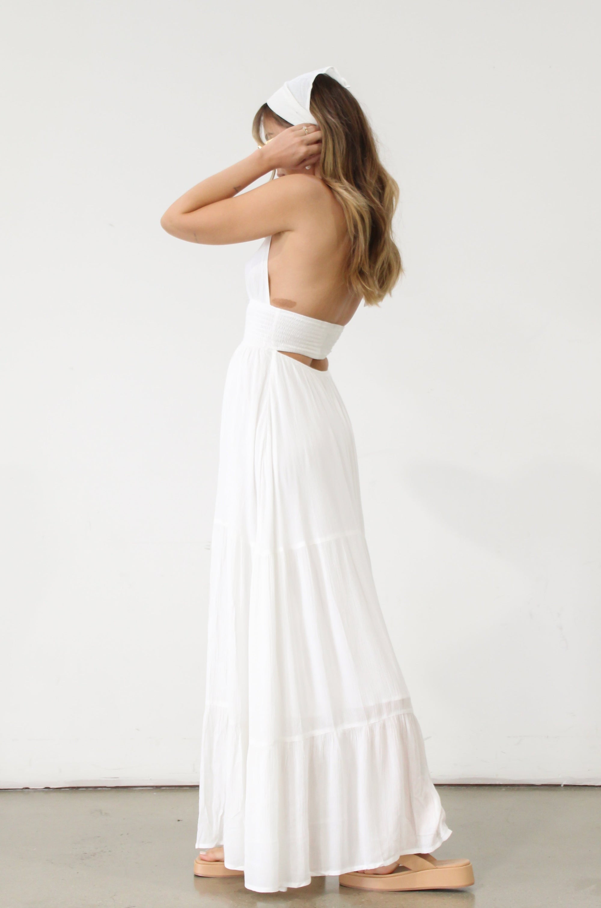Crinkle woven maxi dress. Adjustable halter tie neck. Elastic smocked waist. Elastic back. Back cut out. Fully lined. White maxi dress. White halter neck dress. Summer dress. dress to wear on vacation. flowy dress. deep v neck dress. European summer outfit 