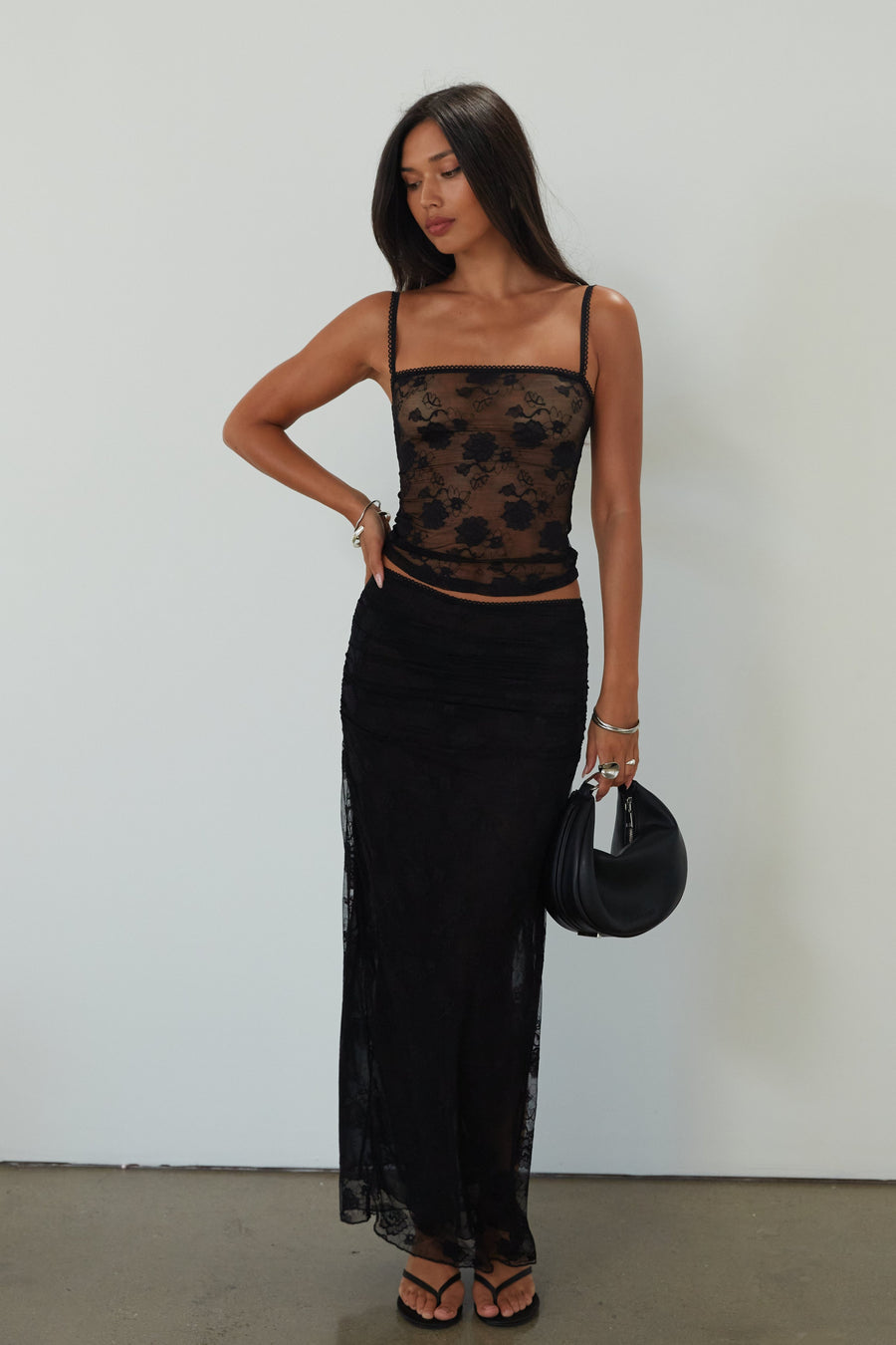 Knit lace tank. Elastic straps. Unlined/sheer. black lace top. black lace tank top. going out top. 