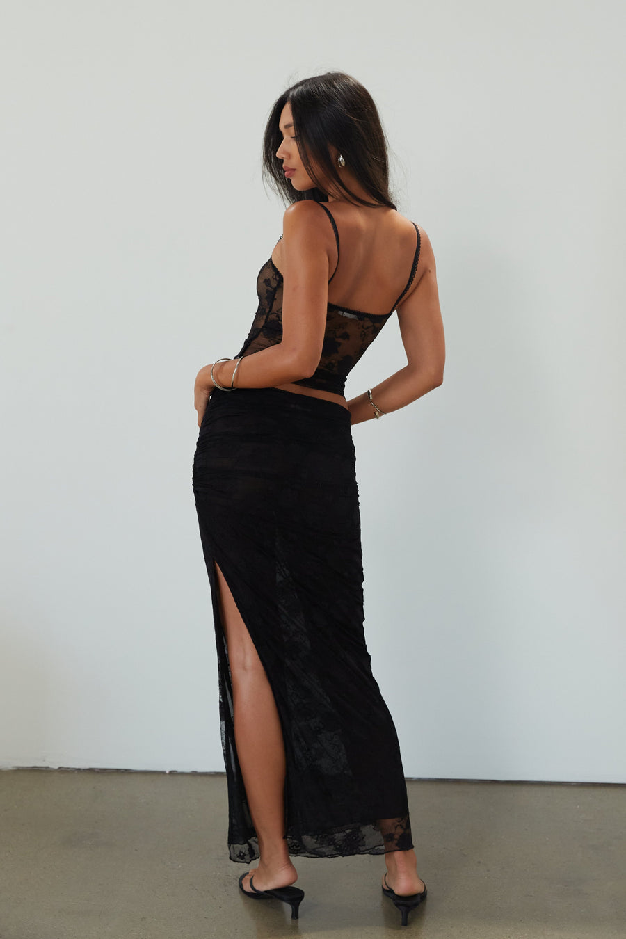 Knit lace maxi skirt. Elastic waist. Ruched sides. Side slit. Fully lined. black lace maxi skirt. going out skirt. 