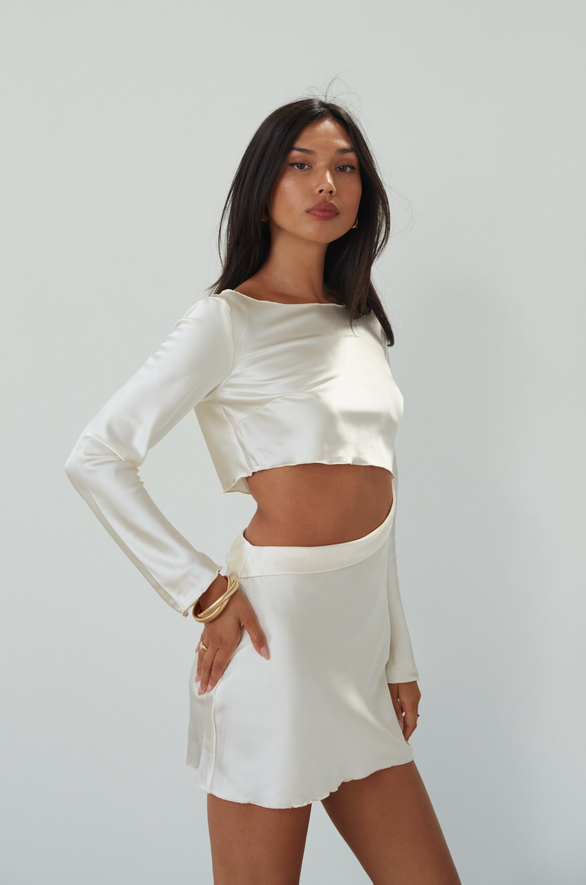 Satin dress. Long sleeves. Side cut out. Side zipper closure. Unlined. off white satin dress. off white mini dress. dress with cut out. cream satin mini dress. bride. bridal dress. engagement dress. bridal shower dress. wedding after party dress