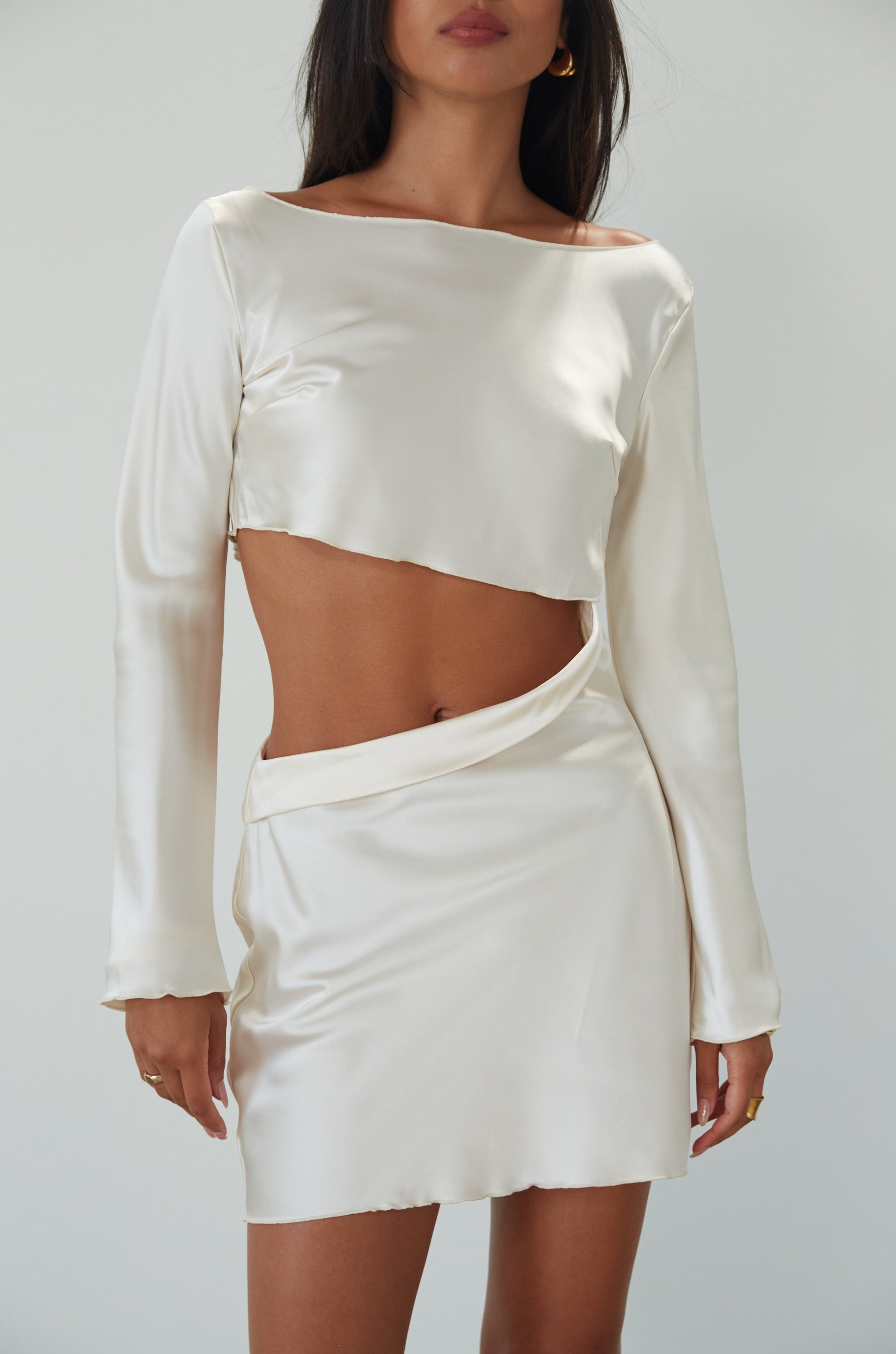 Satin dress. Long sleeves. Side cut out. Side zipper closure. Unlined. off white satin dress. off white mini dress. dress with cut out. cream satin mini dress. bride. bridal dress. engagement dress. bridal shower dress. wedding after party dress