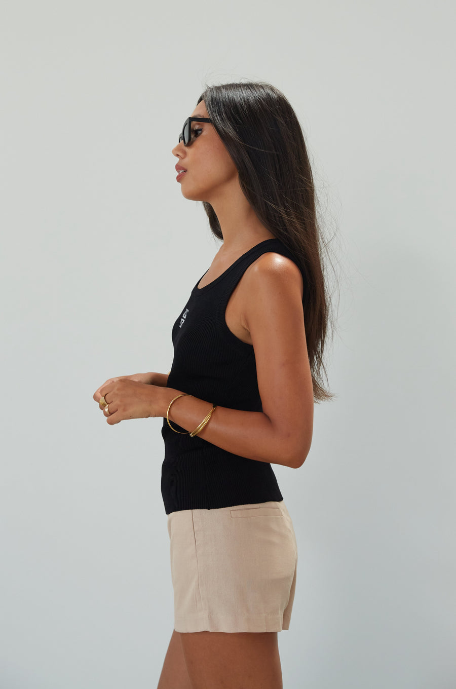 Woven mini skort. Side hook and eye and zipper closures. Back pockets. Shorts lining. mini skort. beige skort. tan skort. summer skort. 