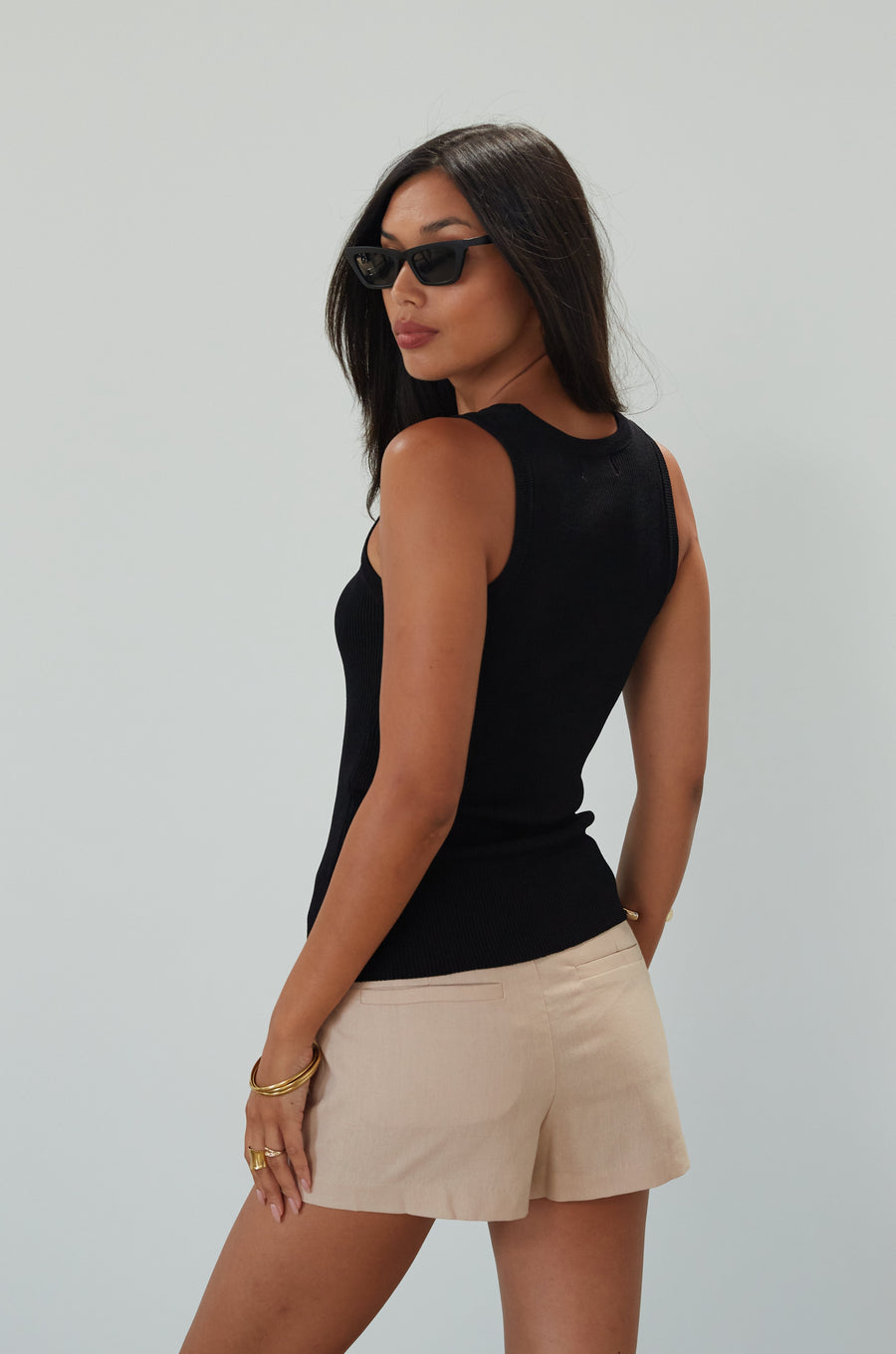 Woven mini skort. Side hook and eye and zipper closures. Back pockets. Shorts lining. mini skort. beige skort. tan skort. summer skort. 