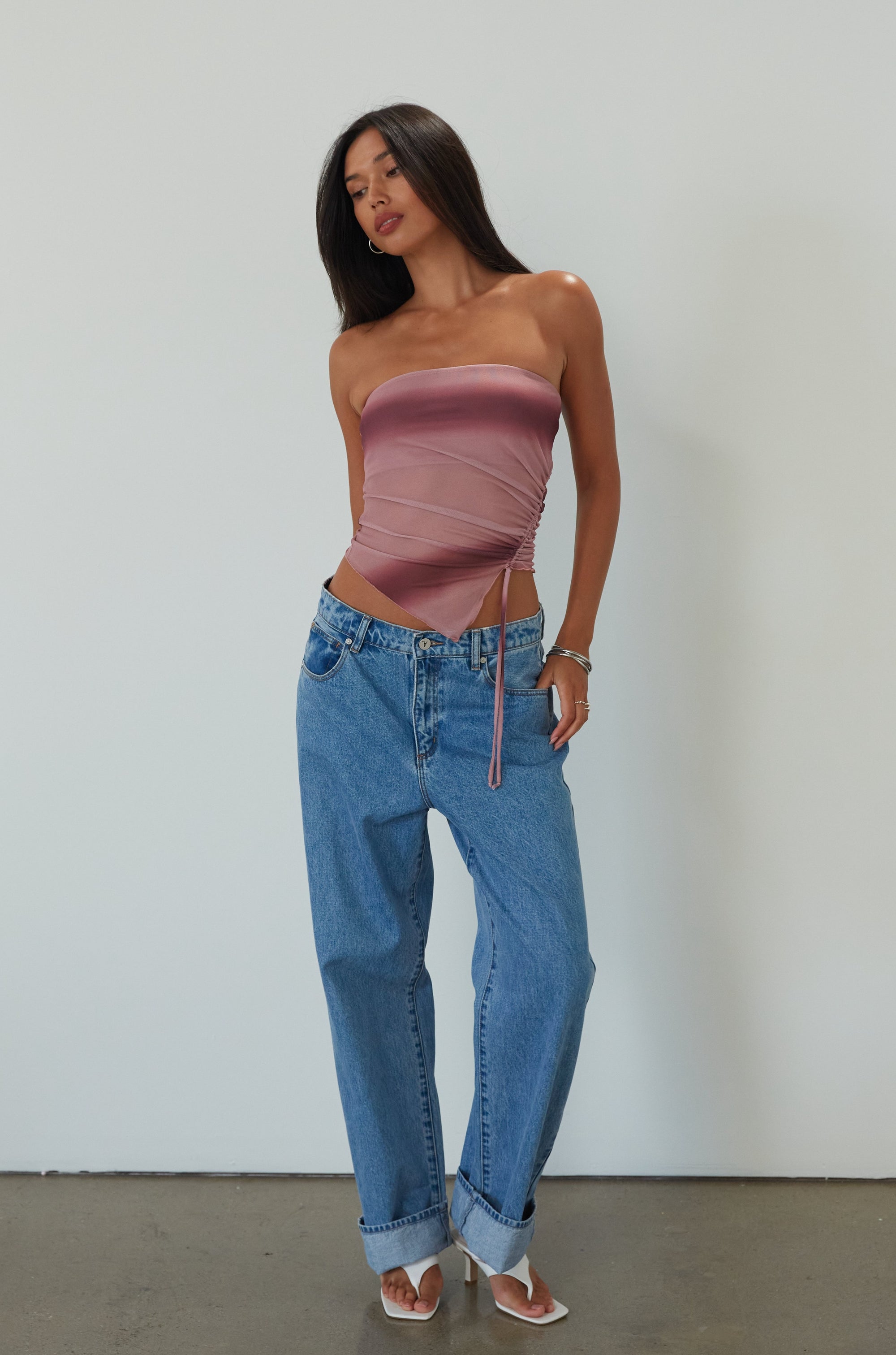 Tie dye knit mesh tube top. Elastic neckline. Side drawstring closure. Asymmetric hem. Partially lined. summer top. summer tube top. pink tube top. mesh tube top. going out top.