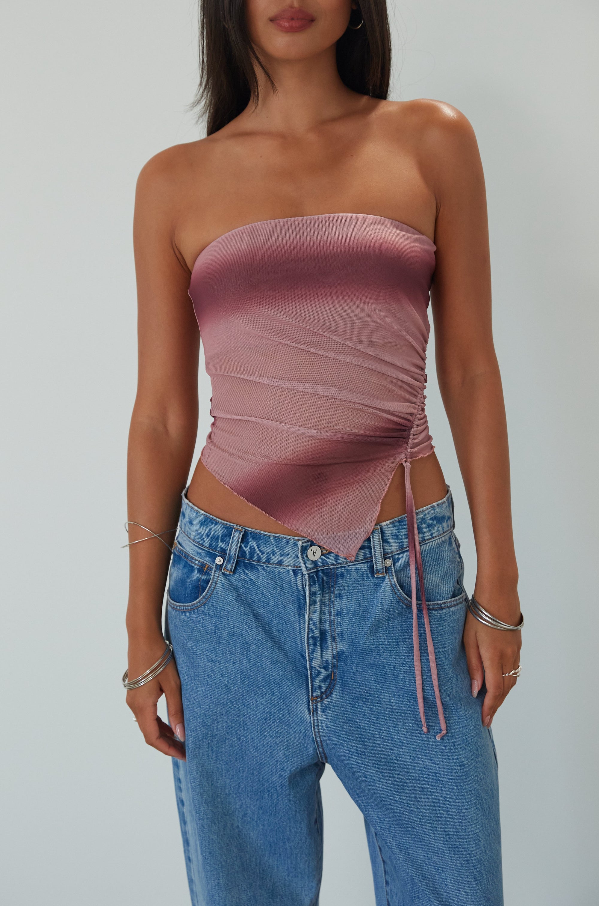 Tie dye knit mesh tube top. Elastic neckline. Side drawstring closure. Asymmetric hem. Partially lined. summer top. summer tube top. pink tube top. mesh tube top. going out top.