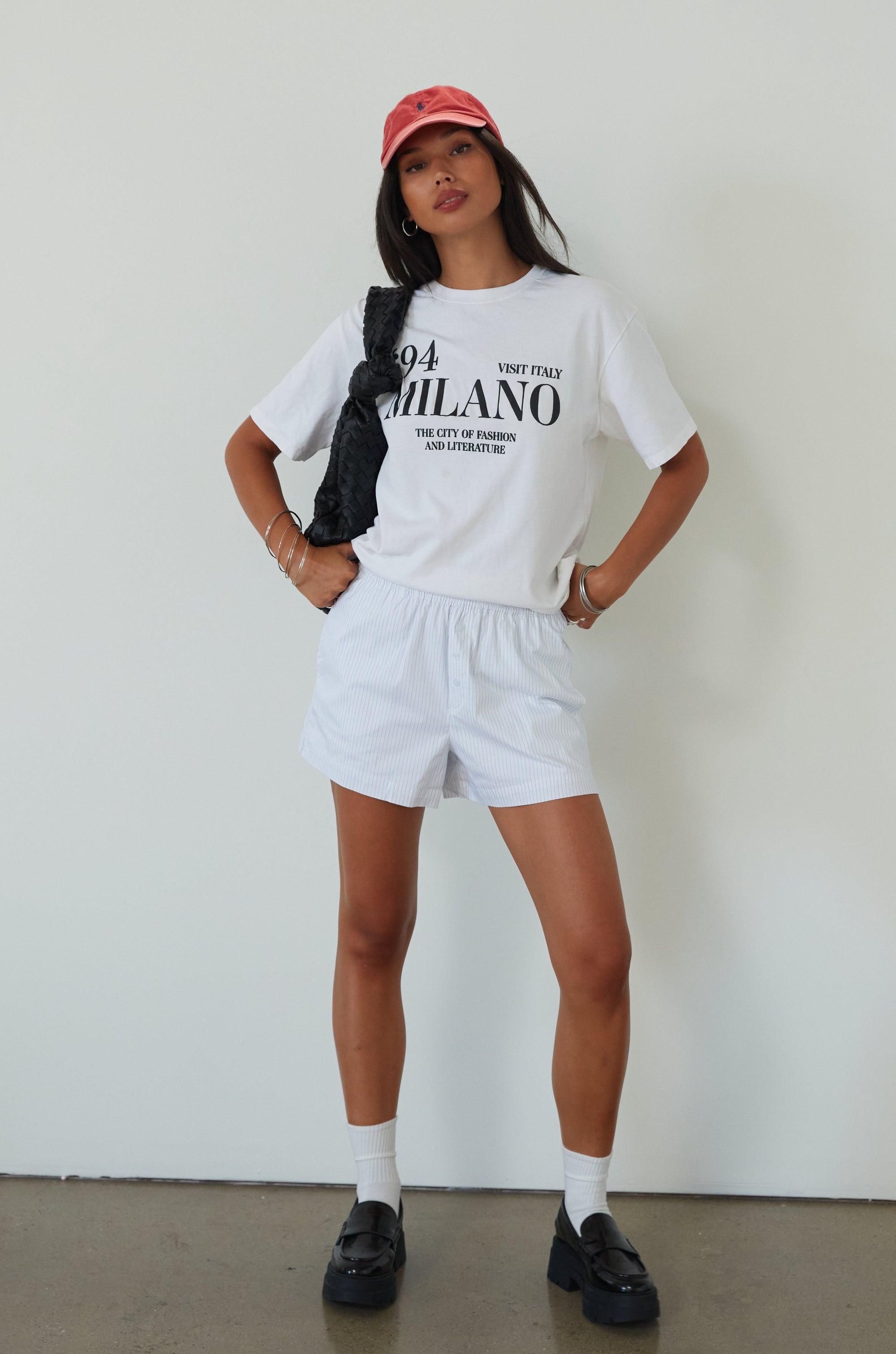 Striped woven shorts. Elastic waistband. Faux front button fly. Side pockets. Fully lined. boxer shorts. cute casual outfit. summer outfit. summer shorts. white and blue boxer shorts. striped boxer shorts