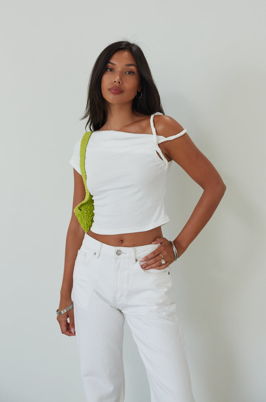 Knit crop top. Asymmetric sleeves. Unlined. white top. summer top. going out top. twist strap. white crop top
