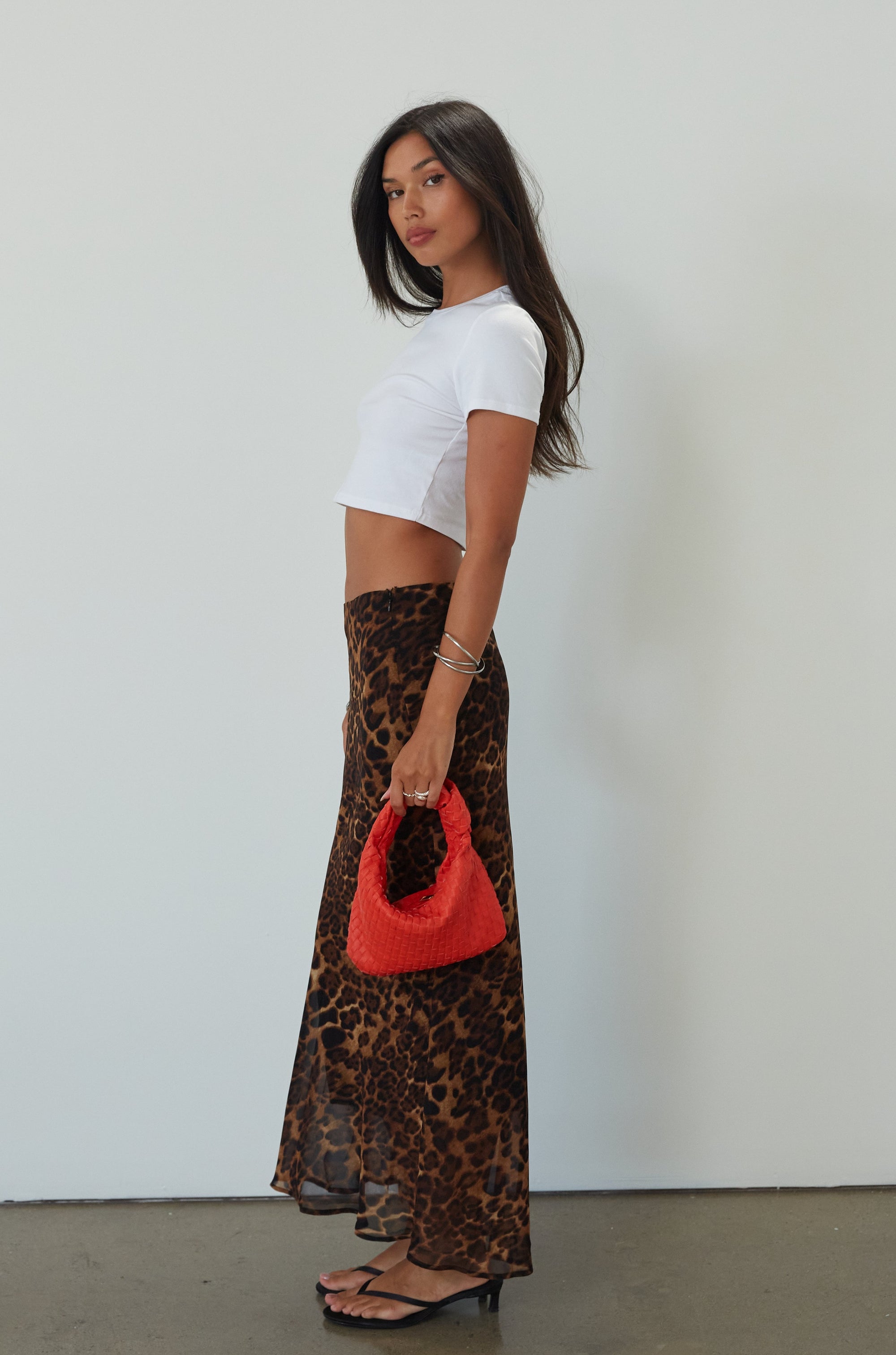 Animal printed chiffon maxi skirt. Side hook and eye and zipper closures. Fully lined. leopard maxi skirt. going out skirt. going out outfit. date night outfit. date night skirt. vacation outfit.