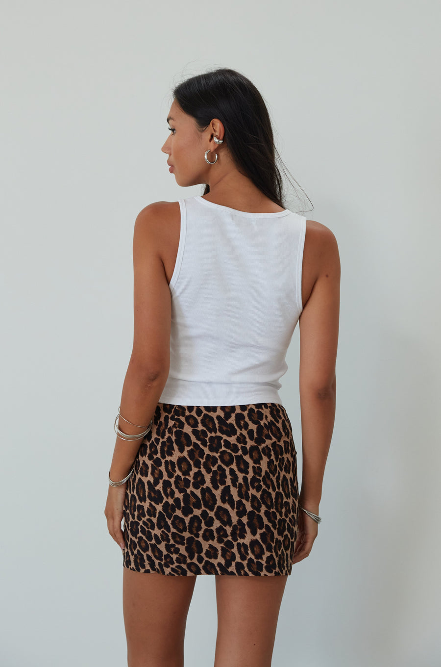 Animal printed woven skirt. Side hook and eye and zipper closures. Unlined. leopard mini skirt. going out skirt. date night skirt. date night outfit. 