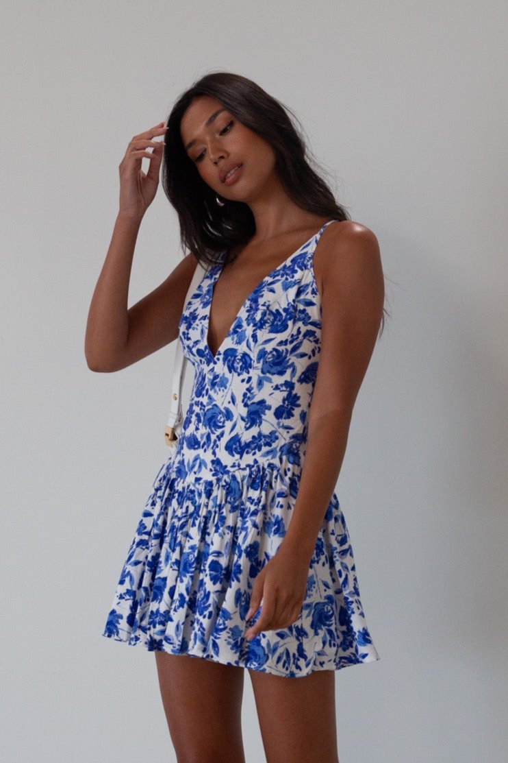 Printed woven dress. Adjustable cross rods back straps with tie closure. Back hook and eye and zipper closures. Fully lined. blue and white floral mini dress. summer dress. greece inspired dress. garden party dress. wedding guest dress. 