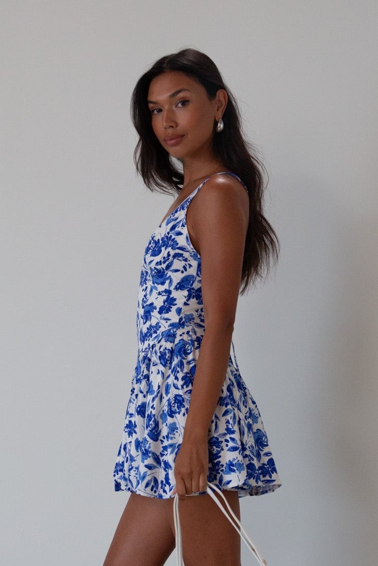 Printed woven dress. Adjustable cross rods back straps with tie closure. Back hook and eye and zipper closures. Fully lined. blue and white floral mini dress. summer dress. greece inspired dress. garden party dress. wedding guest dress. 