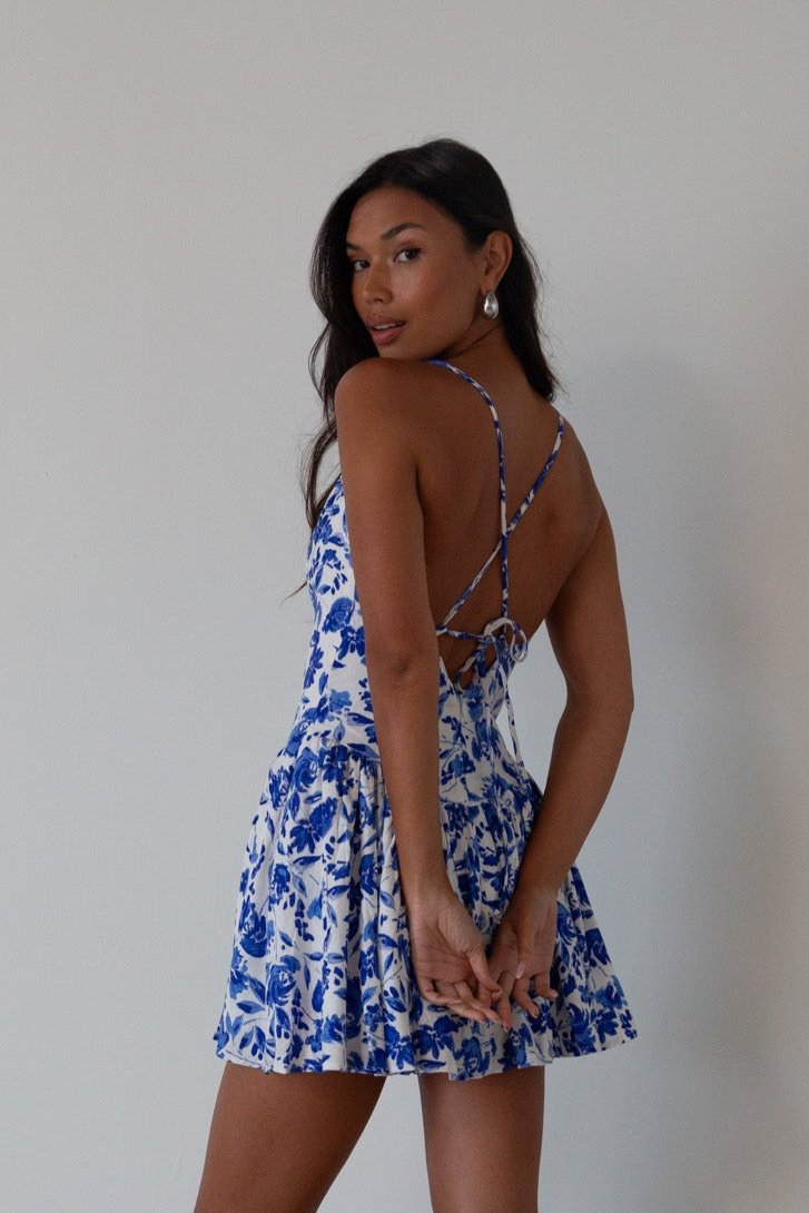 Printed woven dress. Adjustable cross rods back straps with tie closure. Back hook and eye and zipper closures. Fully lined. blue and white floral mini dress. summer dress. greece inspired dress. garden party dress. wedding guest dress. 