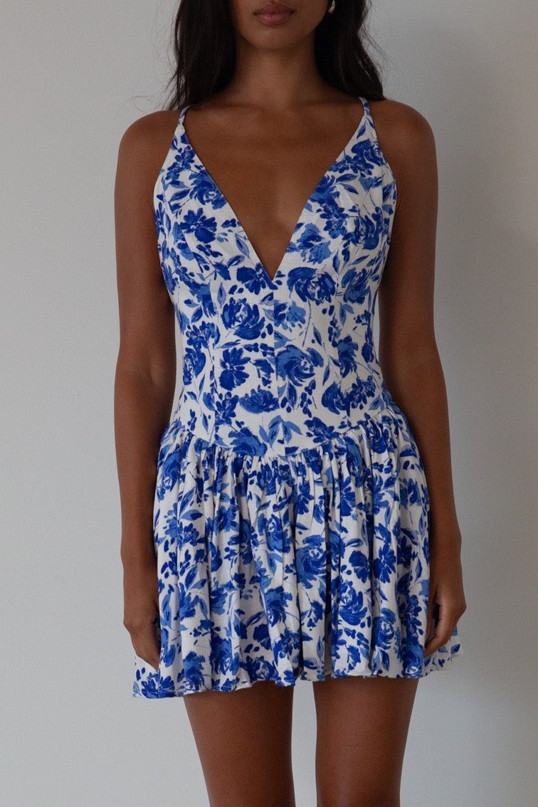 Printed woven dress. Adjustable cross rods back straps with tie closure. Back hook and eye and zipper closures. Fully lined. blue and white floral mini dress. summer dress. greece inspired dress. garden party dress. wedding guest dress. 