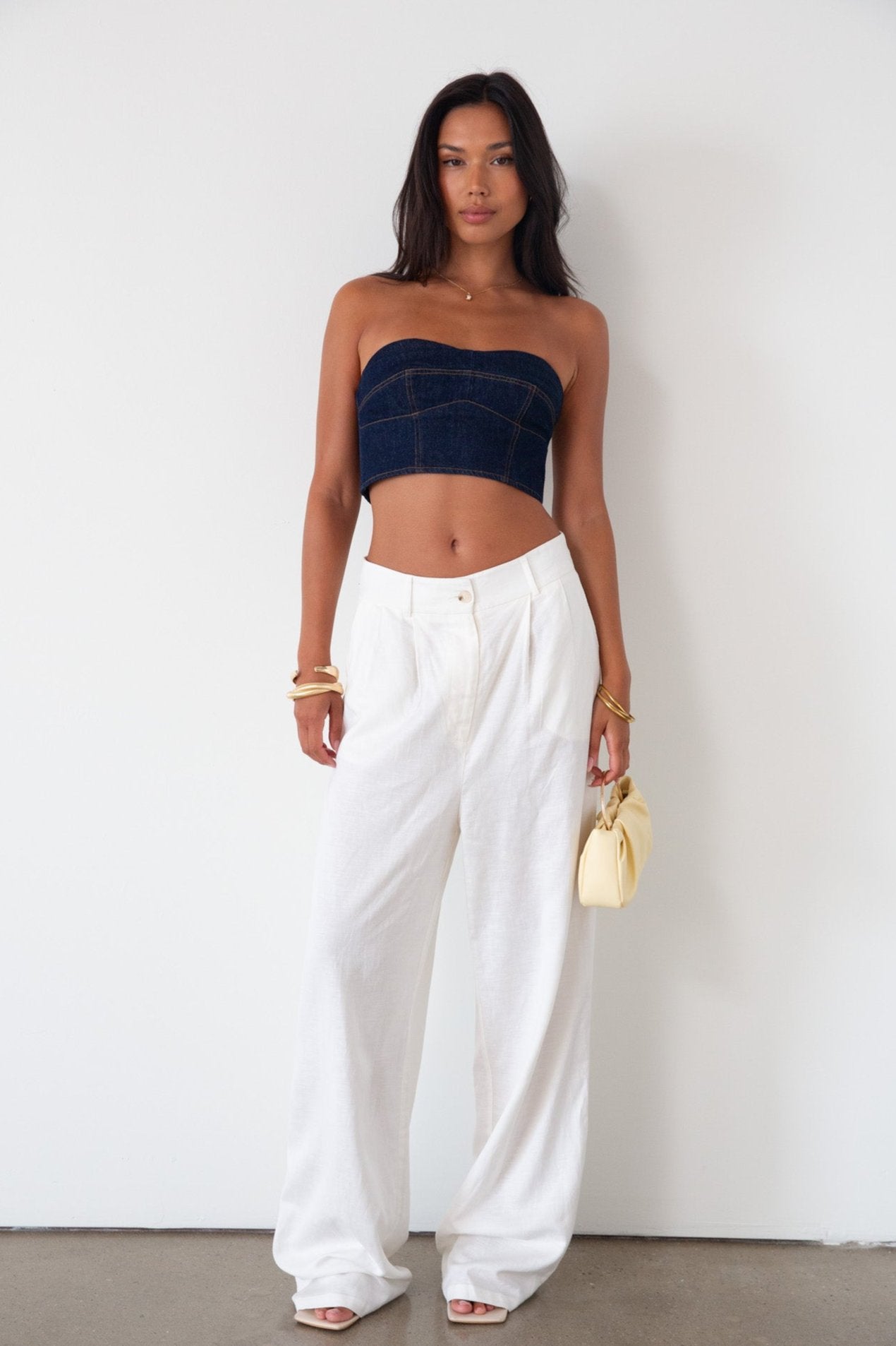 Denim tube top. Strapless neckline. Inner rubber grip lining. Back hook and eye and zipper closures. Fully lined. summer top. going out top