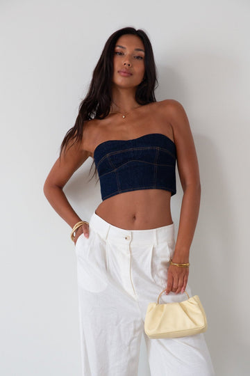 Denim tube top. Strapless neckline. Inner rubber grip lining. Back hook and eye and zipper closures. Fully lined. summer top. going out top