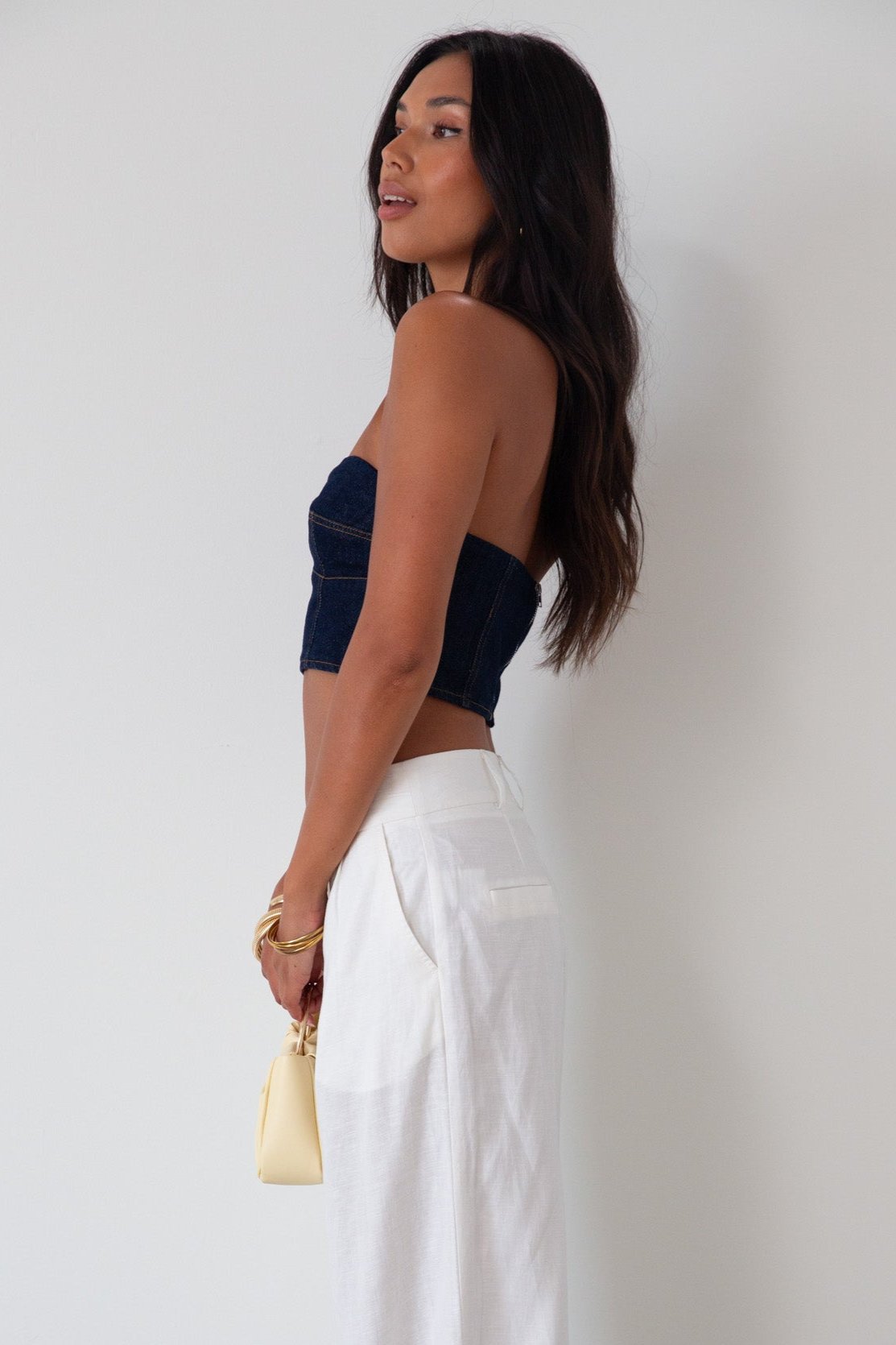Denim tube top. Strapless neckline. Inner rubber grip lining. Back hook and eye and zipper closures. Fully lined. summer top. going out top