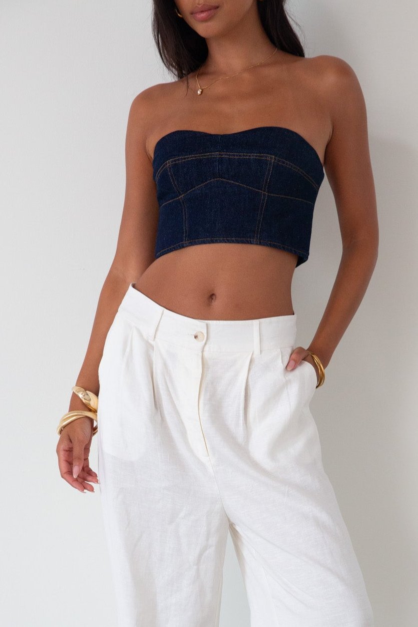 Denim tube top. Strapless neckline. Inner rubber grip lining. Back hook and eye and zipper closures. Fully lined. summer top. going out top