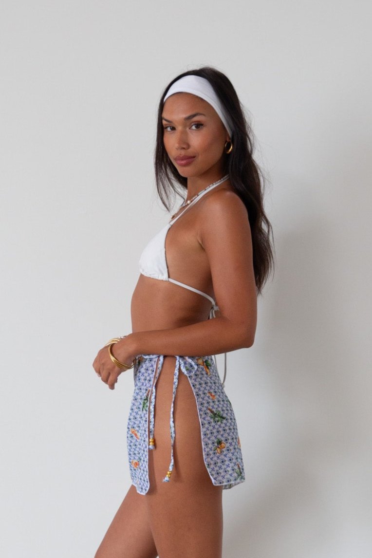 Printed woven mesh skirt. Beaded adjustable side tie closure. Unlined/sheer. skirt cover up. mexico skirt coverup. beach vacation skirt