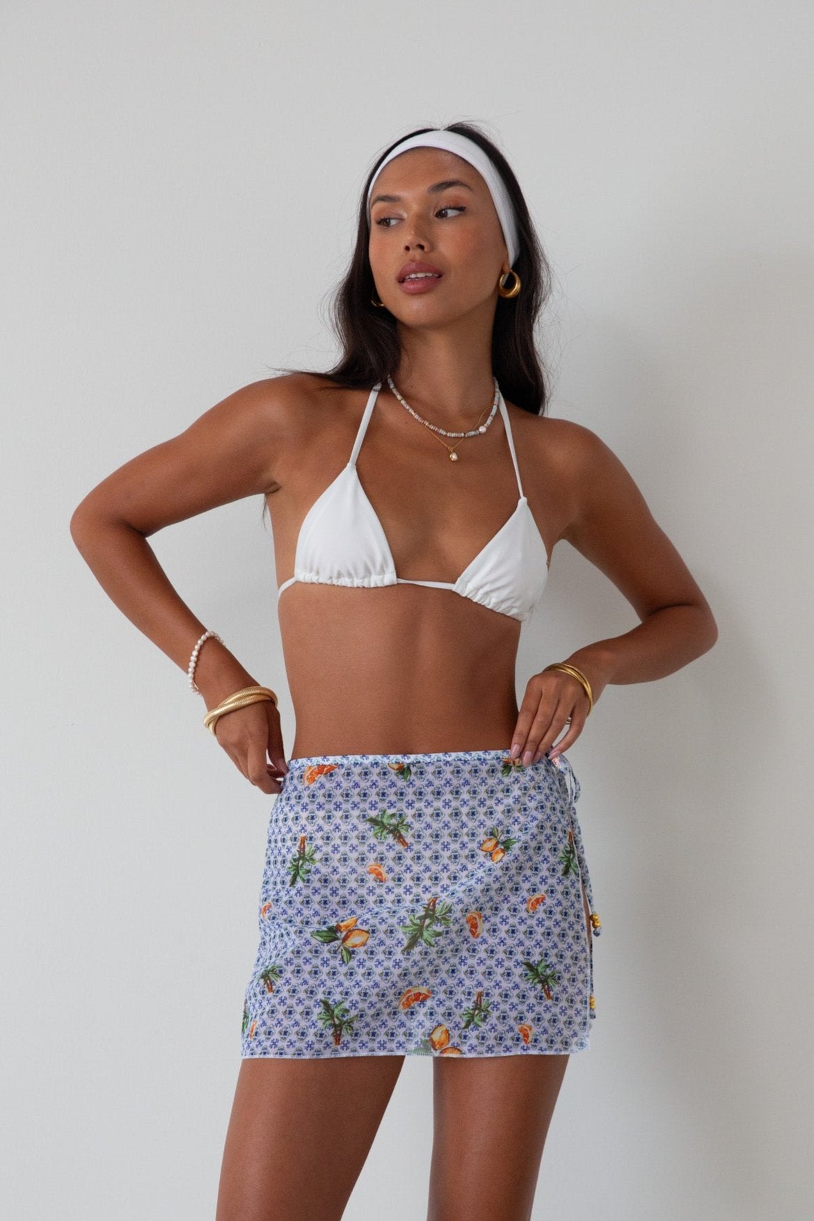 Printed woven mesh skirt. Beaded adjustable side tie closure. Unlined/sheer. skirt cover up. mexico skirt coverup. beach vacation skirt