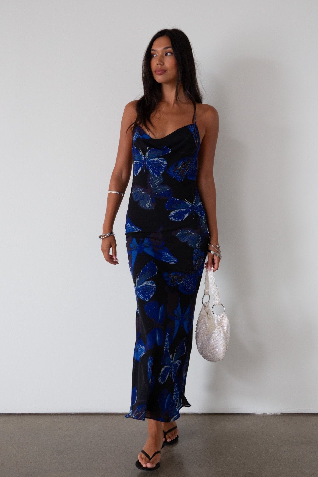 Printed chiffon maxi dress. Adjustable cross cross back straps. Side zipper closure. Fully lined. butterfly dress. blue maxi dress