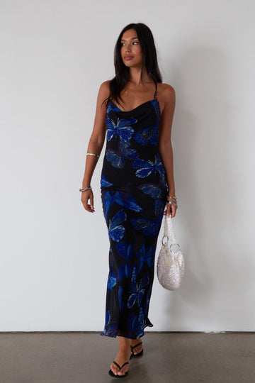 Printed chiffon maxi dress. Adjustable cross cross back straps. Side zipper closure. Fully lined. butterfly dress. blue maxi dress