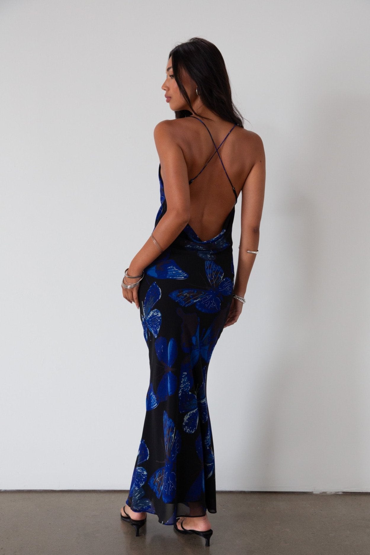Printed chiffon maxi dress. Adjustable cross cross back straps. Side zipper closure. Fully lined. butterfly dress. blue maxi dress