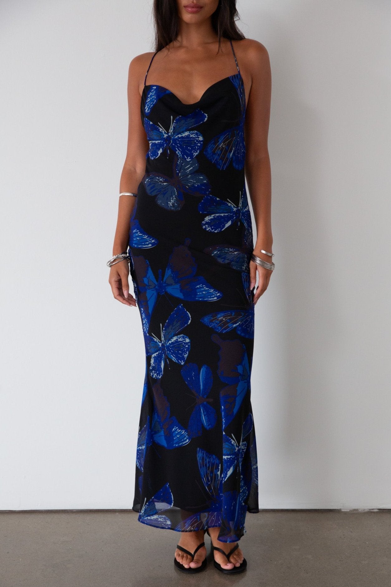 Printed chiffon maxi dress. Adjustable cross cross back straps. Side zipper closure. Fully lined. butterfly dress. blue maxi dress