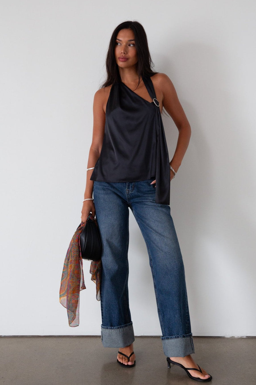 Denim wide leg jeans. Button and zipper fly. Five pocket construction. Cuffed hems. Unlined. dark wash denim jeans. fold up denim jeans. fold up pants. fold up jeans. 