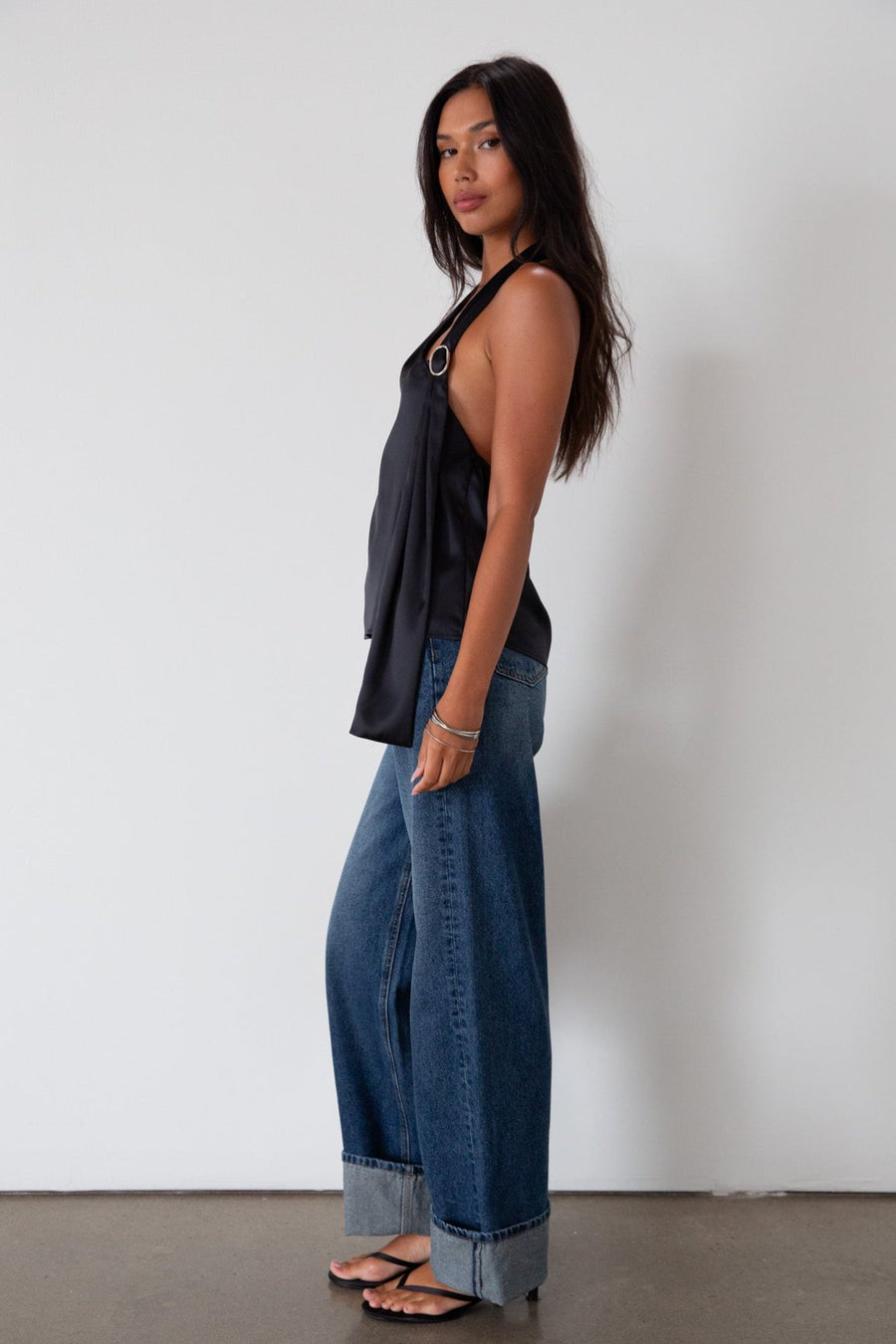 Denim wide leg jeans. Button and zipper fly. Five pocket construction. Cuffed hems. Unlined. dark wash denim jeans. fold up denim jeans. fold up pants. fold up jeans. 