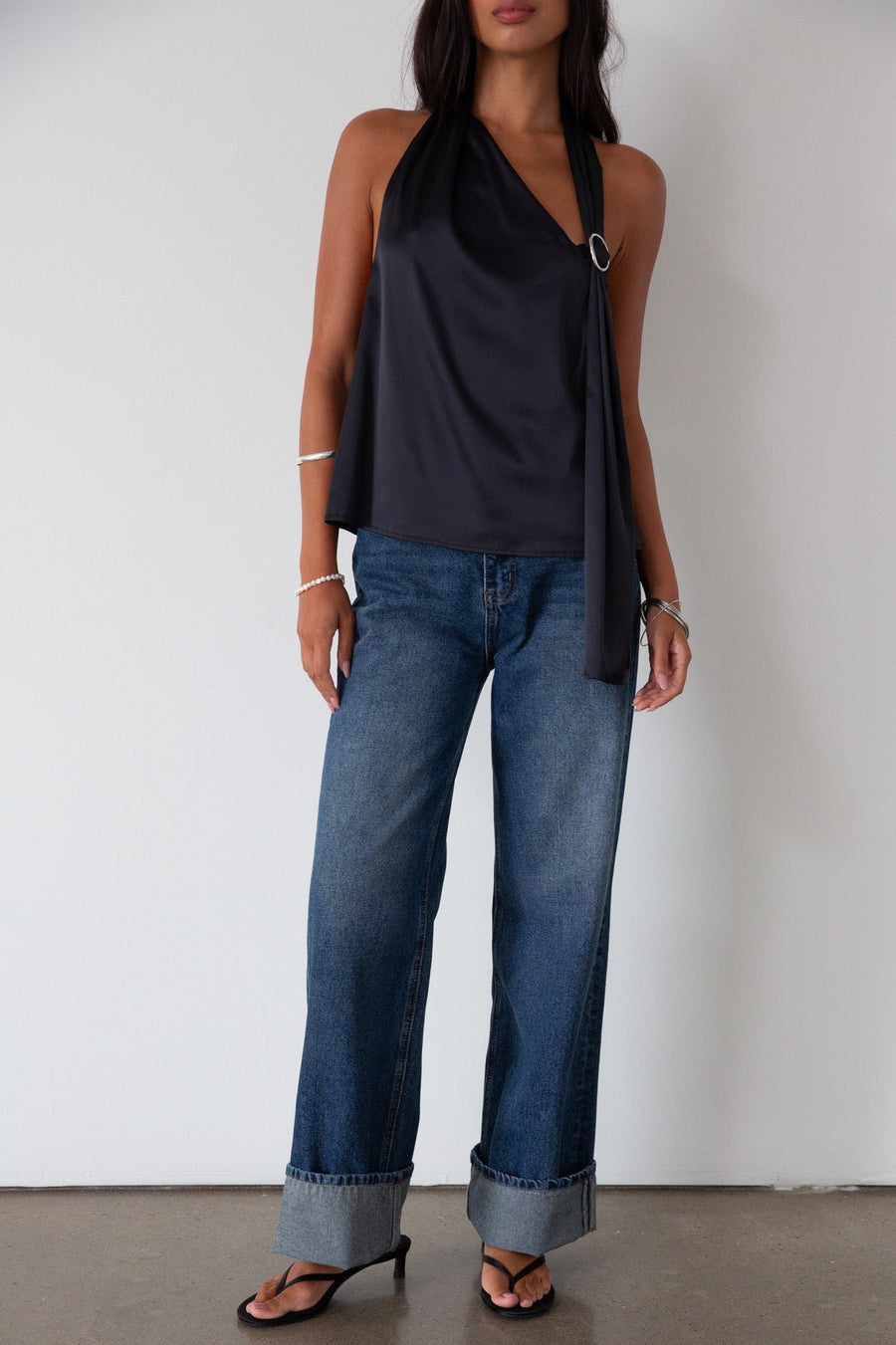 Denim wide leg jeans. Button and zipper fly. Five pocket construction. Cuffed hems. Unlined. dark wash denim jeans. fold up denim jeans. fold up pants. fold up jeans. 
