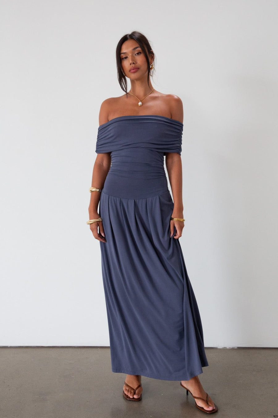 Knit maxi dress. Strapless elastic neckline. Off the shoulder short sleeves. Ruched sides. Unlined. Blue maxi dress. blue sleeveless maxi dress. Fold over dress. wedding guest dress. drop waist maxi dress
