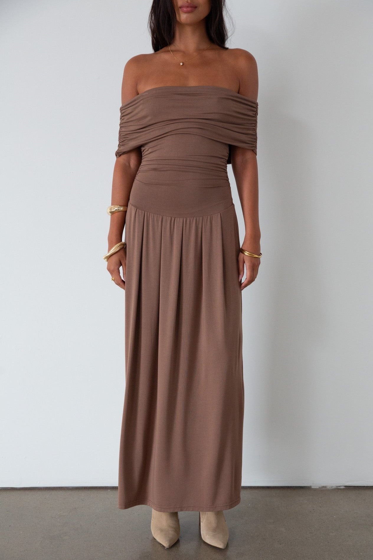 Knit maxi dress. Strapless elastic neckline. Off the shoulder short sleeves. Ruched sides. Unlined. brown maxi dress. brown sleeveless maxi dress. Fold over dress. wedding guest dress. drop waist maxi dress