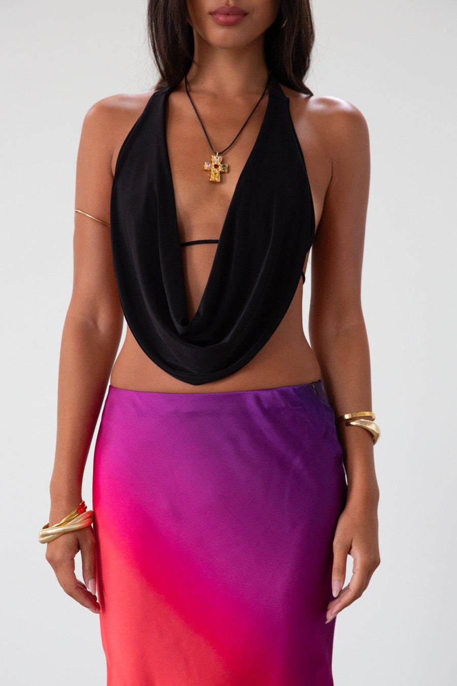 Knit bikini top with draped front. Adjustable back tie closures. Fully lined. black going out top. backless top. black halter top