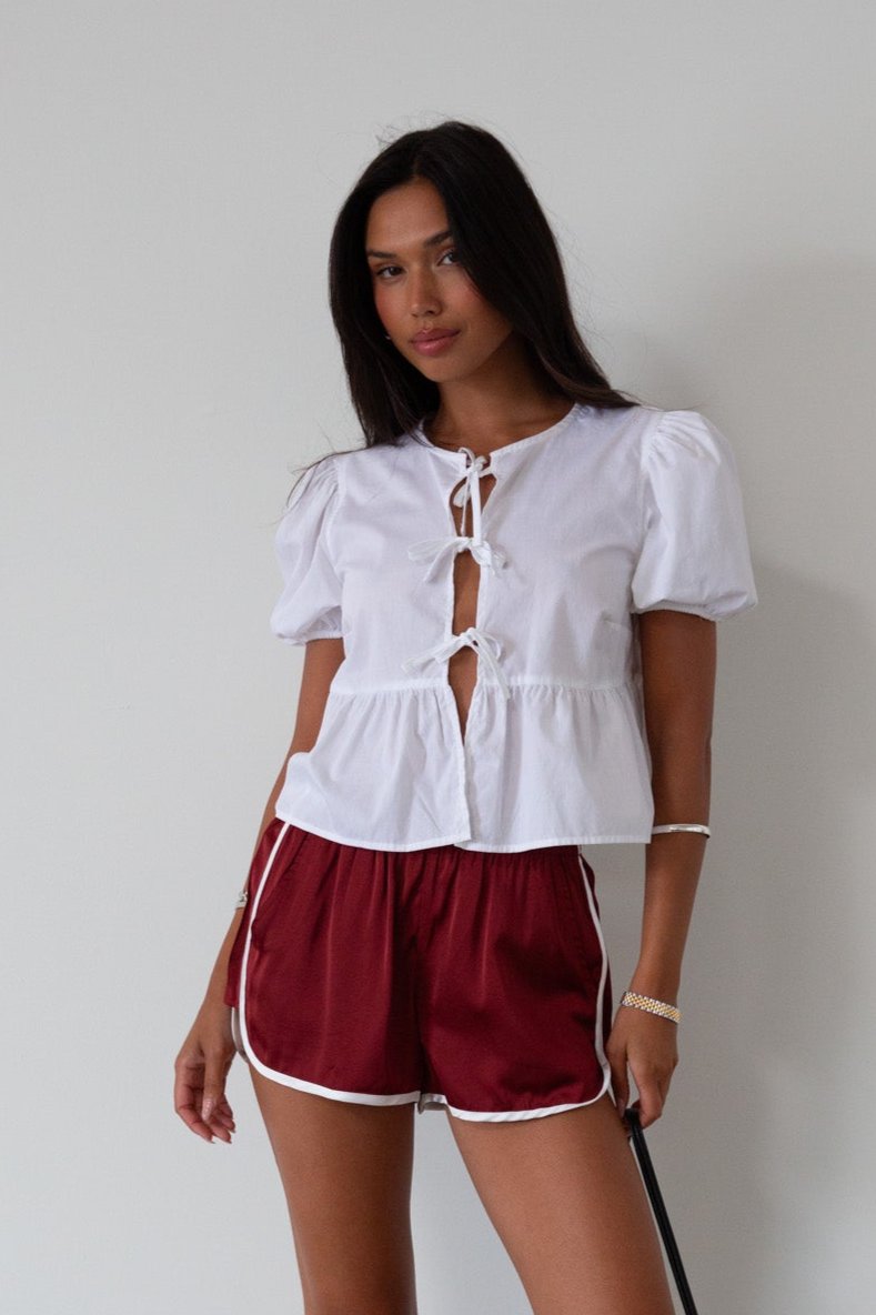 Satin shorts. Elastic waist. Side pockets. Unlined. cute track shorts. fashion track short. red shorts. red track shorts. 
