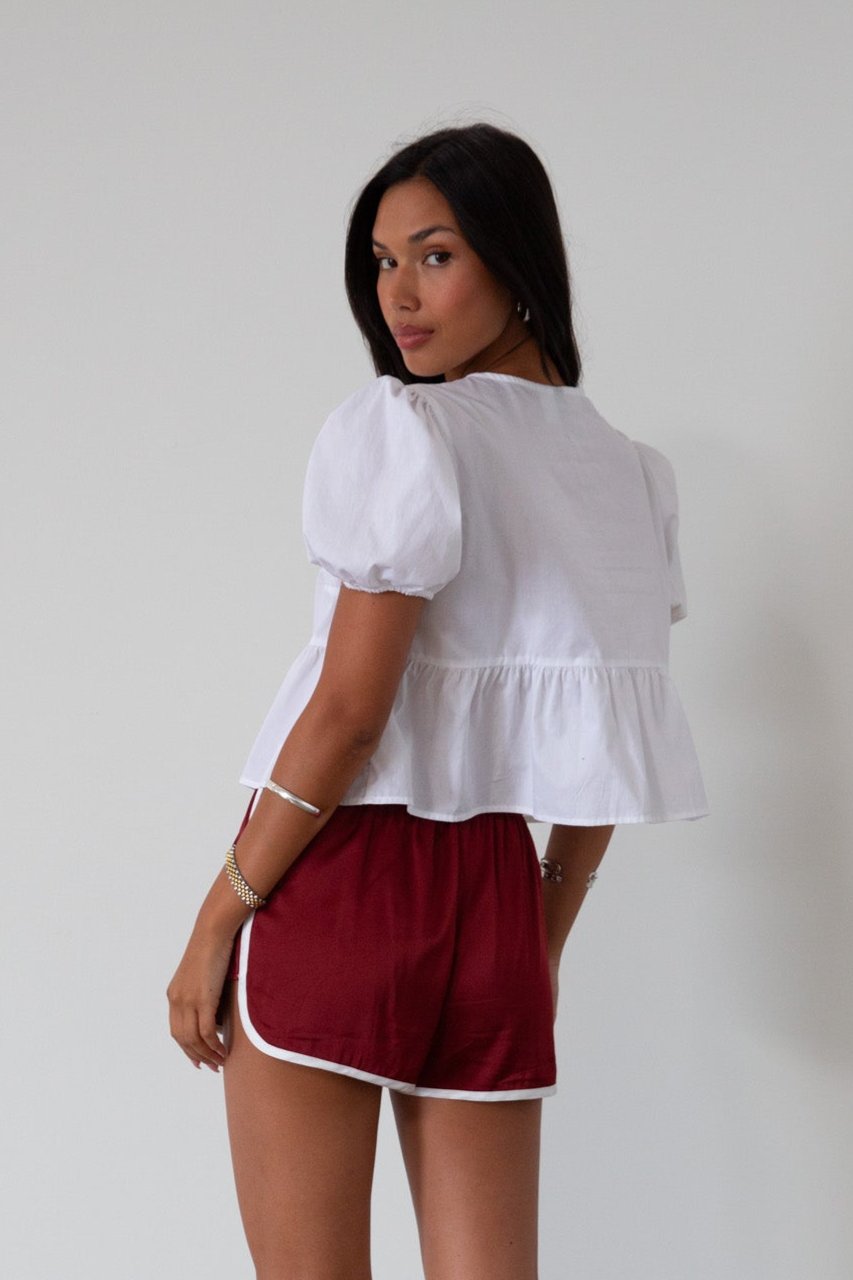 Satin shorts. Elastic waist. Side pockets. Unlined. cute track shorts. fashion track short. red shorts. red track shorts. 