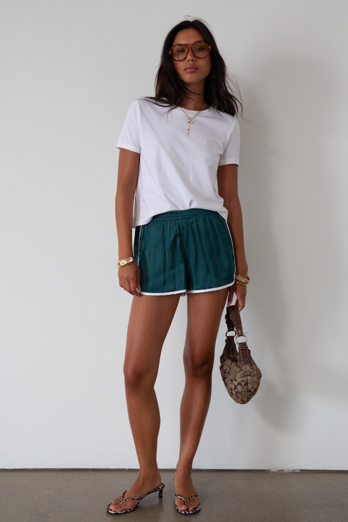 Satin shorts. Elastic waist. Side pockets. Unlined. cute track shorts. fashion track short. green shorts. green track shorts. 
