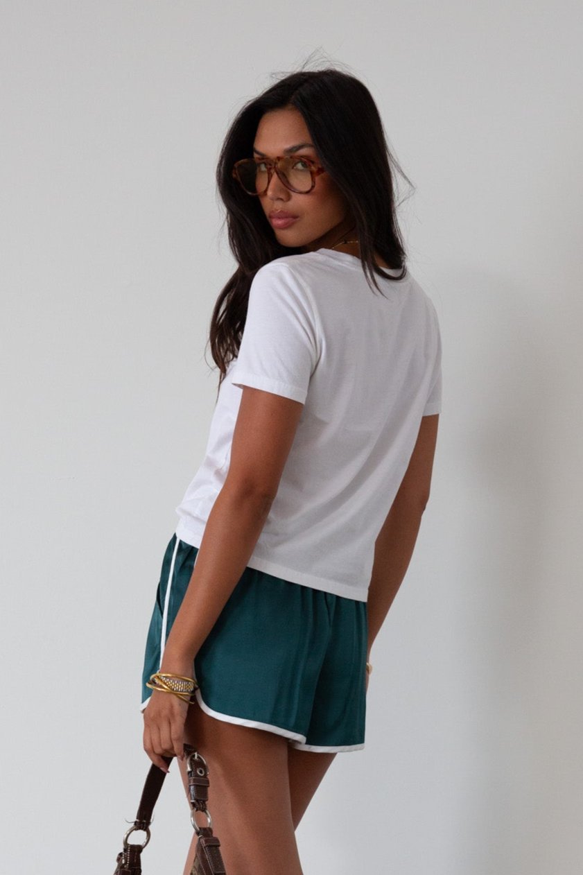 Satin shorts. Elastic waist. Side pockets. Unlined. cute track shorts. fashion track short. green shorts. green track shorts. 