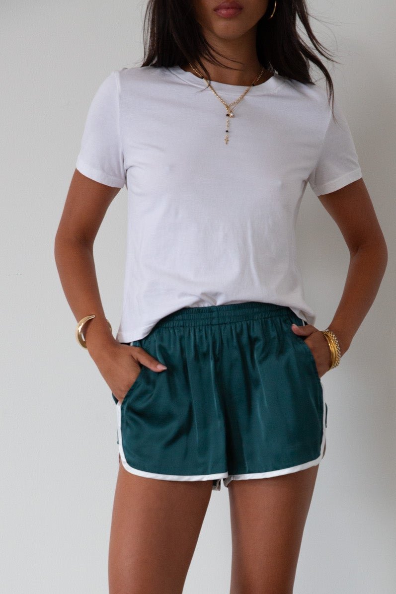 Satin shorts. Elastic waist. Side pockets. Unlined. cute track shorts. fashion track short. green shorts. green track shorts. 