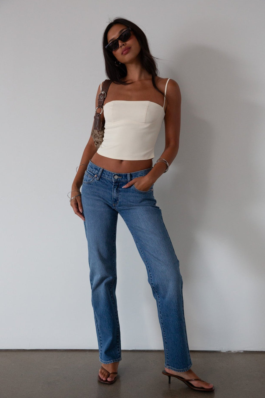 Woven crop top. Fixed straps. Back hook and eye and zipper closures. Fully lined. cream tank top. cream crop top tank. summer top. going out top