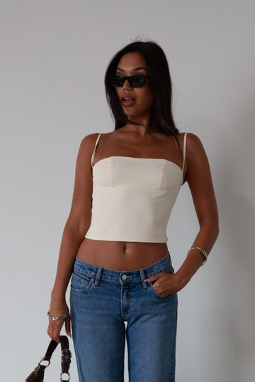 Woven crop top. Fixed straps. Back hook and eye and zipper closures. Fully lined. cream tank top. cream crop top tank. summer top. going out top